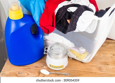 Baking Soda With Detergent And Pile Of Dirty Laundry