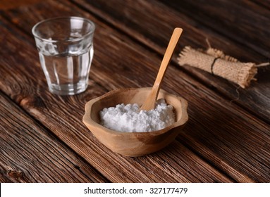 Baking Soda Into The Bowl With Wooden Spoon