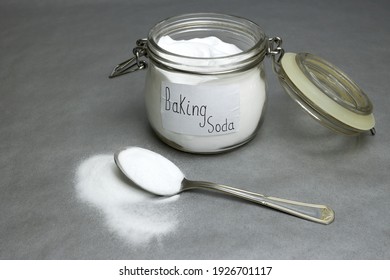 Baking soda isolated on gray background - Shutterstock ID 1926701117