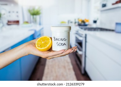 Baking Soda, Lemon, Cooker, Stove, Oven, Kitchen Unit, Kitchen Sink And Cleaning Kitchen. Natural And Eco-friendly Cleaning Products In Hand
