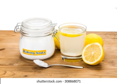 Baking soda with lemon juice in glass for multiple holistic usages