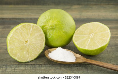 Baking Soda And Lemon On Wooden Table