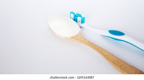 Baking Soda On A Spoon And A Toothbrush. Selective Focus