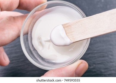 Baking Soda Paste On A Wooden Stick