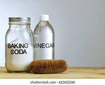 Baking Soda Vinegar And Brush On The Wooden Table