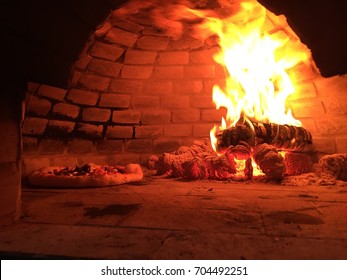 Baking A Sourdough Pizza On A Wood Fire Oven