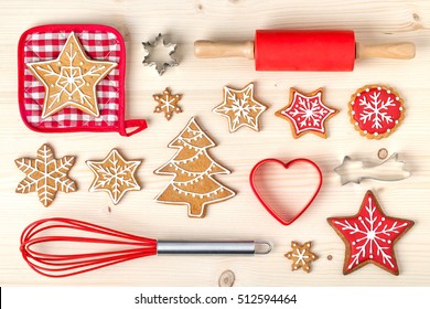 baking tools and christmas homemade gingerbread cookies on wooden background. snowflake, star, christmas tree shapes. holiday, celebration and cooking concept. new year and christmas postcard - Powered by Shutterstock