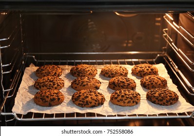 Baking Tray With Chocolate Chip Oatmeal Cookies In Oven