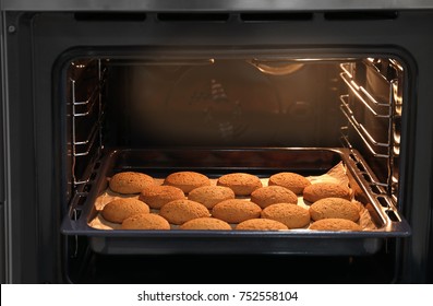 Baking Tray With Delicious Oatmeal Cookies In Oven