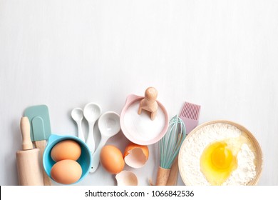 Baking Utensils And Cooking Ingredients For Tarts, Cookies, Dough And Pastry. Flat Lay With Eggs, Flour, Sugar, Berries.Top View, Mockup For Recipe, Culinary Classes, Cooking Blog.