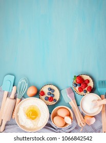 Baking Utensils And Cooking Ingredients For Tarts, Cookies, Dough And Pastry. Flat Lay With Eggs, Flour, Sugar, Berries.Top View, Mockup For Recipe, Culinary Classes, Cooking Blog.