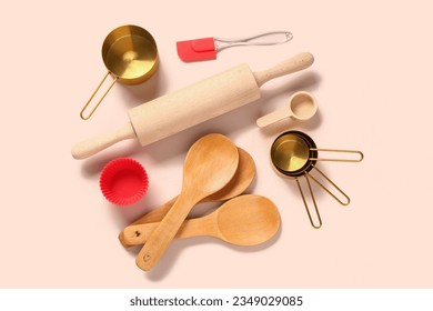 Baking utensils on beige background