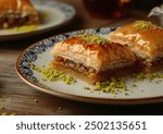 Baklava arranged artistically on a plate, showcasing the intricate layers of pastry and nuts, professional food photography with a stunning angle view.