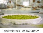 Baklava making, handmade Turkish dessert, local Gaziantep baklava.
Baklava with pistachios, katmer craftsmanship.