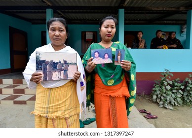 Baksa, Assam, India. 16 February 2019.Martyr Maneshwar Basumatary Wife And Daughter Holds A Photograph In His Residence Who Martyred In The Terror Attack That Took Place In Pulwama In Jammu & Kashmir.