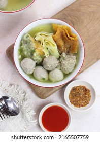 Bakso Malang, Meatball Soup with Various Side Dish like Tofu Fried Shiumay, or Bakso Goreng. Served on the Table with Sambal, Soysauce, and Tomato Sauce. Selected Focus