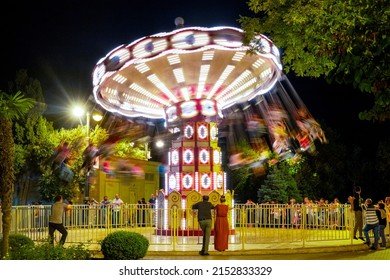 Baku, Azerbaijan - 08 12 2019: Chair Swing Ride On The Boulevard
