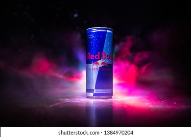 BAKU, AZERBAIJAN - April 20, 2018: Red Bull classic 250 ml can on dark toned foggy background. Red Bull is an energy drink sold by Austrian company Red Bull GmbH