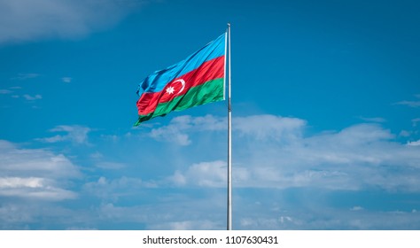 Baku, Azerbaijan - April 2018: Azerbaijan Flag Against Blue Sky