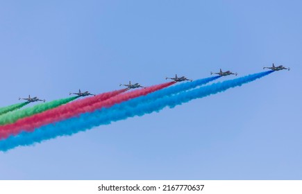 BAKU, Azerbaijan - MAY 28, 2022: Stormtroopers of the Azerbaijani armed forces release the smoke of the Azerbaijani flag