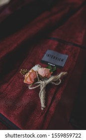 Baku/Azerbaijan - 01.05.2018: Wedding boutonniere for the groom . Wine red color suite. Wedding details in close-up view. 