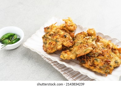 Bakwan Sayur Or Bala-bala Or Vegetable Fritter, Indonesian Snack Made From Flour, Cabbage, Carrots And Bean Sprouts, Served With Chili Or Chili Sauce. 
