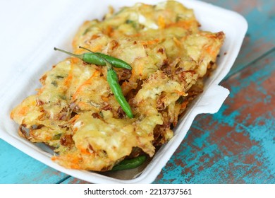 Bala Bala Or Bakwan, A Traditional Indonesian Snack. Popular Takjil For Iftar In Indonesia, Bala-Bala Or Sayur Goreng, Made From Flour Dough With Carrots And Cabbage Diced And Fried. Served With Clove