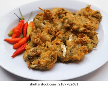 Bala-bala Or Bakwan Or Vegetable Fritter, Traditional Indonesian Snack, Made From Carrot, Cabbage And Bean Sprouts And Mix With Flour And Deep Fried. Served With Chillies And Peanuts Sauce