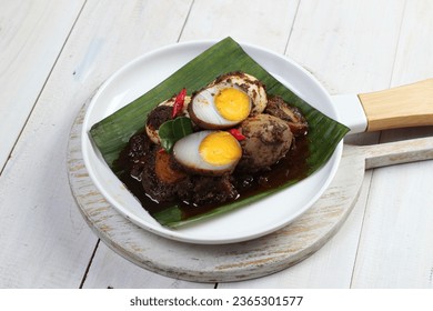Balado Telor is a traditional Indonesian dish, eggs are boiled and then cooked with chili sauce - Shutterstock ID 2365301577