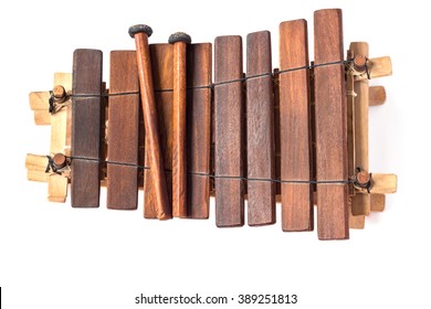 Balafon, african musical instrument of wood and gourds on white background.