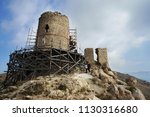 BALAKLAVA / RF - October 10, 2014: Genoese fortress Cembalo  (1357) surrounded by building forests for restoration, stands on Mount Kastron against the sky.