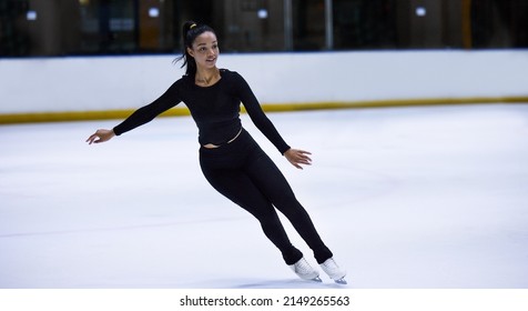 Balance Is All A Skate Of Mind. Shot Of A Young Woman Figure Skating At A Sports Arena.