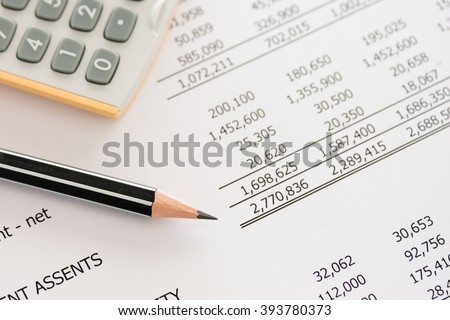 Balance sheet ,pencil, calculator on accountant's desk. Accounting , accounts concept. top view, above view.