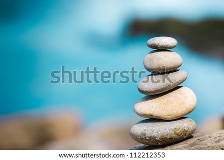Balance stone on river coast