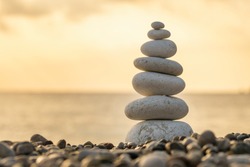 Balance Stones Close-up On The Beach At Sunrise