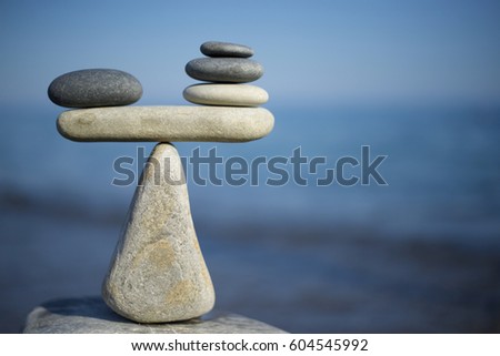 Balance of stones. To weight pros and cons.