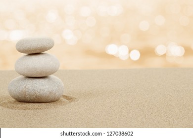 Balance Zen Stones In Sand On White Background