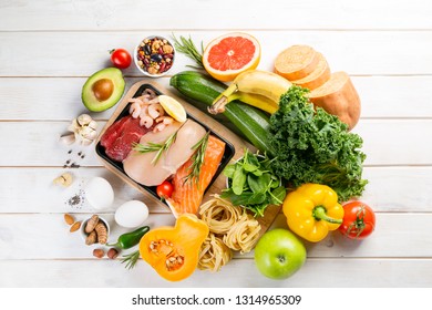 Balanced Diet Concept - Fresh Meat, Fish, Pasta, Fruits And Vegetables, Nuts, Seeds Copy Space