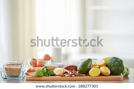 balanced diet, cooking, culinary and food concept - close up of vegetables, fruits and meat on wooden table