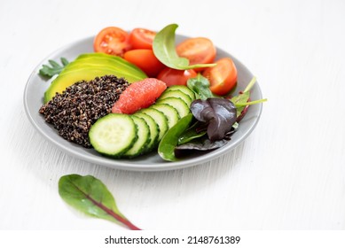 Balanced diet dish with fresh raw vegetables for vegans and peop