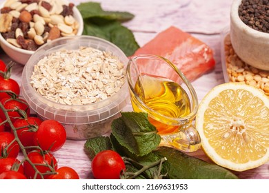 Balanced Diet Food Background. Organic Food For Healthy Nutrition, Vegetables,hercules,olive Oil,fish,herbs,nuts,dried Fruits, Seeds And Greens.