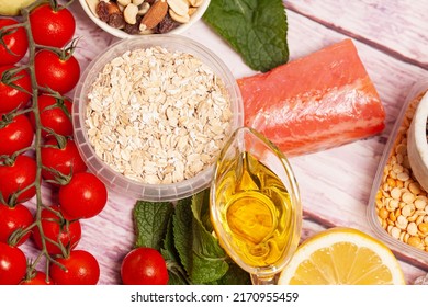 Balanced Diet Food Background. Organic Food For Healthy Nutrition, Vegetables,hercules,olive Oil,fish,herbs,nuts,dried Fruits, Seeds And Greens.