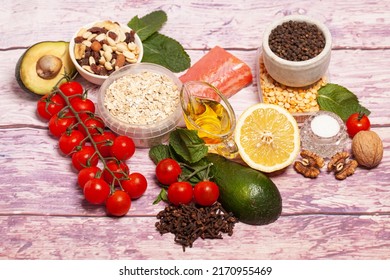 Balanced Diet Food Background. Organic Food For Healthy Nutrition, Vegetables,hercules,olive Oil,fish,herbs,nuts,dried Fruits, Seeds And Greens.