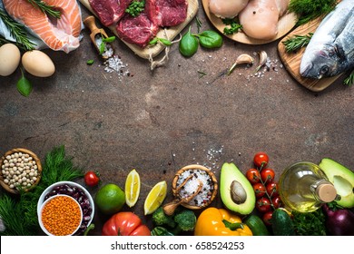 Balanced Diet Food Background. Organic Food For Healthy Nutrition. Meat Fish Beans And Vegetables. Top View Copy Space On Dark Stone Table.