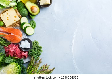 Balanced Diet Nutrition Keto Concept. Assortment Of Healthy Ketogenic Low Carb Food Ingredients For Cooking On A Kitchen Table. Green Vegetables, Meat, Salmon, Cheese, Eggs