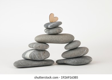 Balanced gray zen pebbles on white background. Zen stones. Spa and healthcare concept.  - Powered by Shutterstock