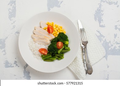 Balanced Meal Or Diet Concept. Chicken With Rice And Vegetables