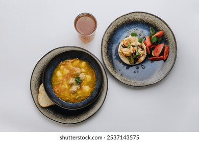 Balanced meal with soup, grilled vegetables, salad, and herbal tea. Perfect for a nutritious lunch - Powered by Shutterstock