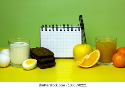 Balanced Nutrition Concept For Bland Diet. Weight Loss Planning. Milk, Bread, Eggs, Juice, Fruits On Yellow And Green Background. Copy Space.
