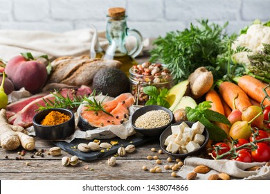 Balanced nutrition concept for clean eating flexitarian mediterranean diet. Assortment of healthy food ingredients for cooking on a wooden kitchen table. - Shutterstock ID 1438074866